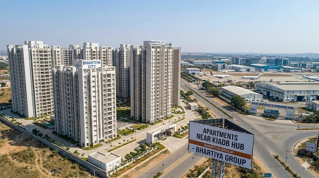 Exterior view of modern residential apartment buildings located near the KIADB industrial hub.