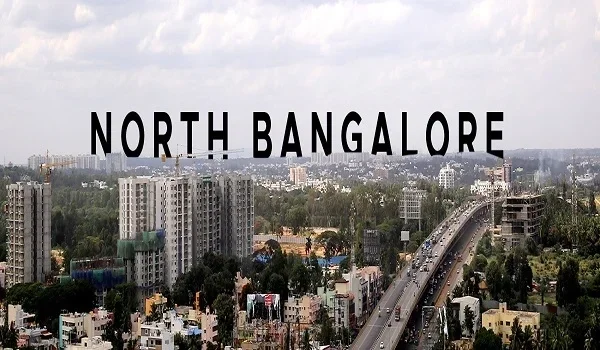 High-angle view of North Bangalore residential corridor and infrastructure projects near the International Airport.